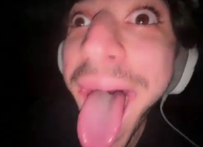 mel wearing a headset and making a silly face
